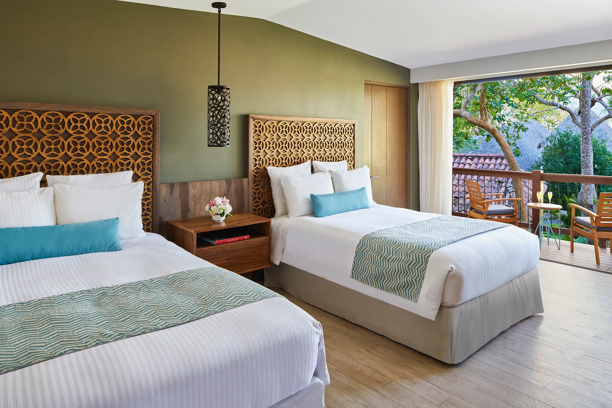 Bungalow Suite Tropical View with two double beds and balcony access at Secrets Papagayo Costa Rica.
