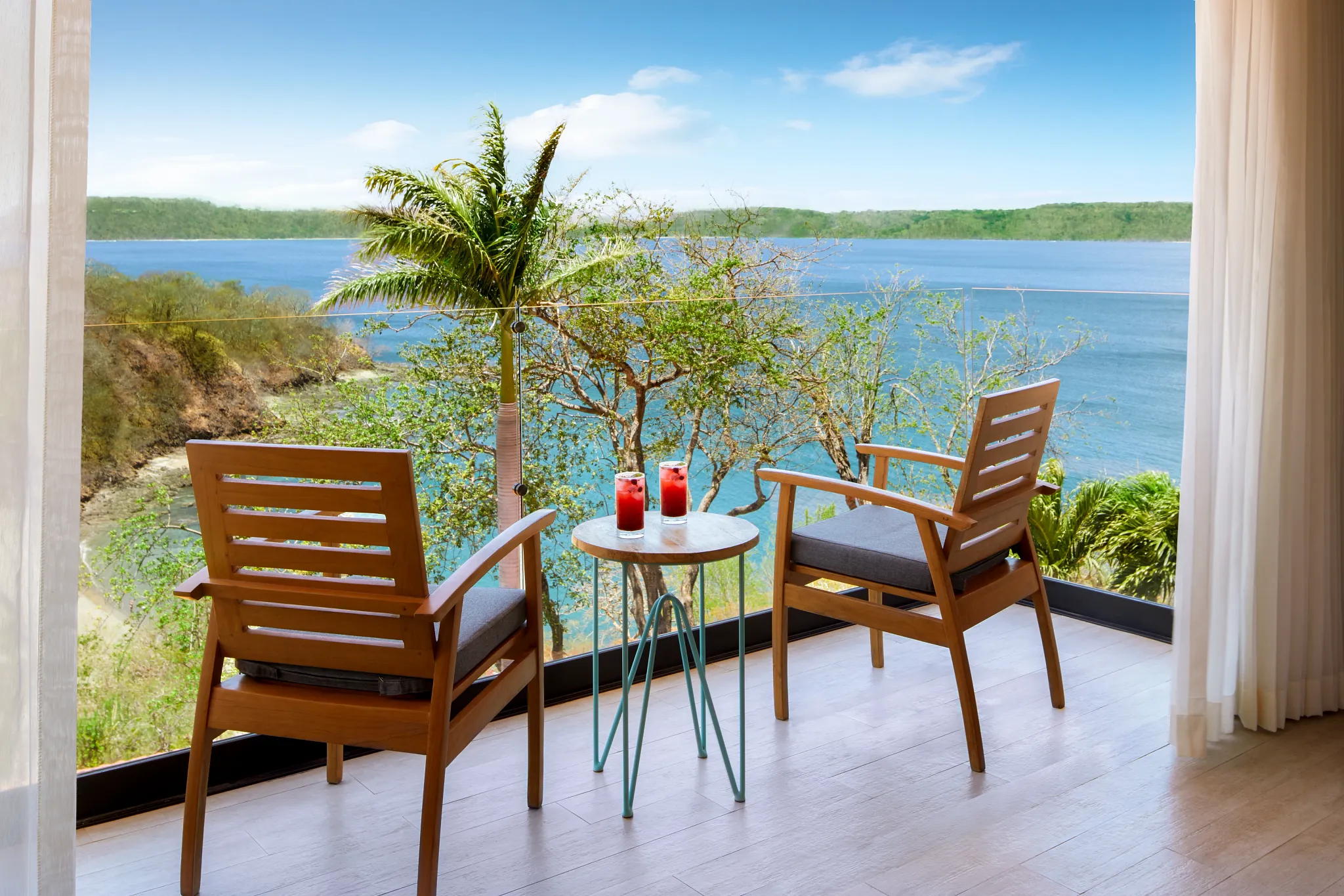 Private furnished balcony with ocean views at a Deluxe Ocean View King room in Secrets Papagayo Costa Rica.