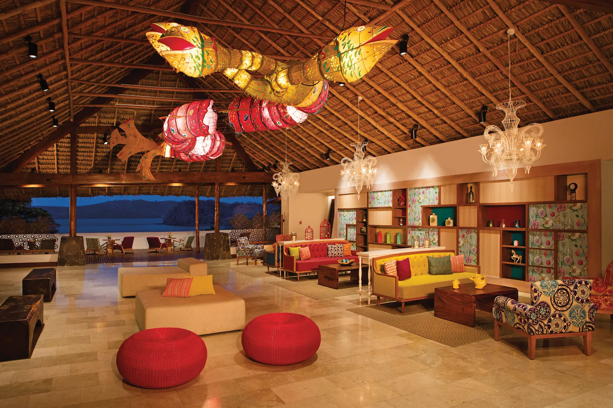 Stylish open-air lobby lounge with colorful décor at Secrets Papagayo Costa Rica.