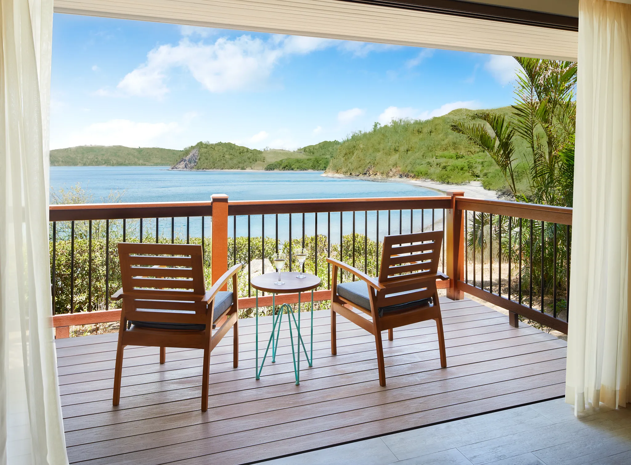 Private furnished balcony with ocean views at the Preferred Club Bungalow Suite in Secrets Papagayo Costa Rica.