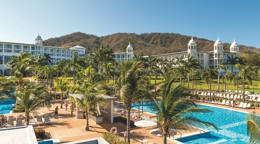 Riu Palace Costa Rica all-inclusive resort in Guanacaste with beachfront pools, modern architecture, and family-friendly amenities on Matapalo Beach.