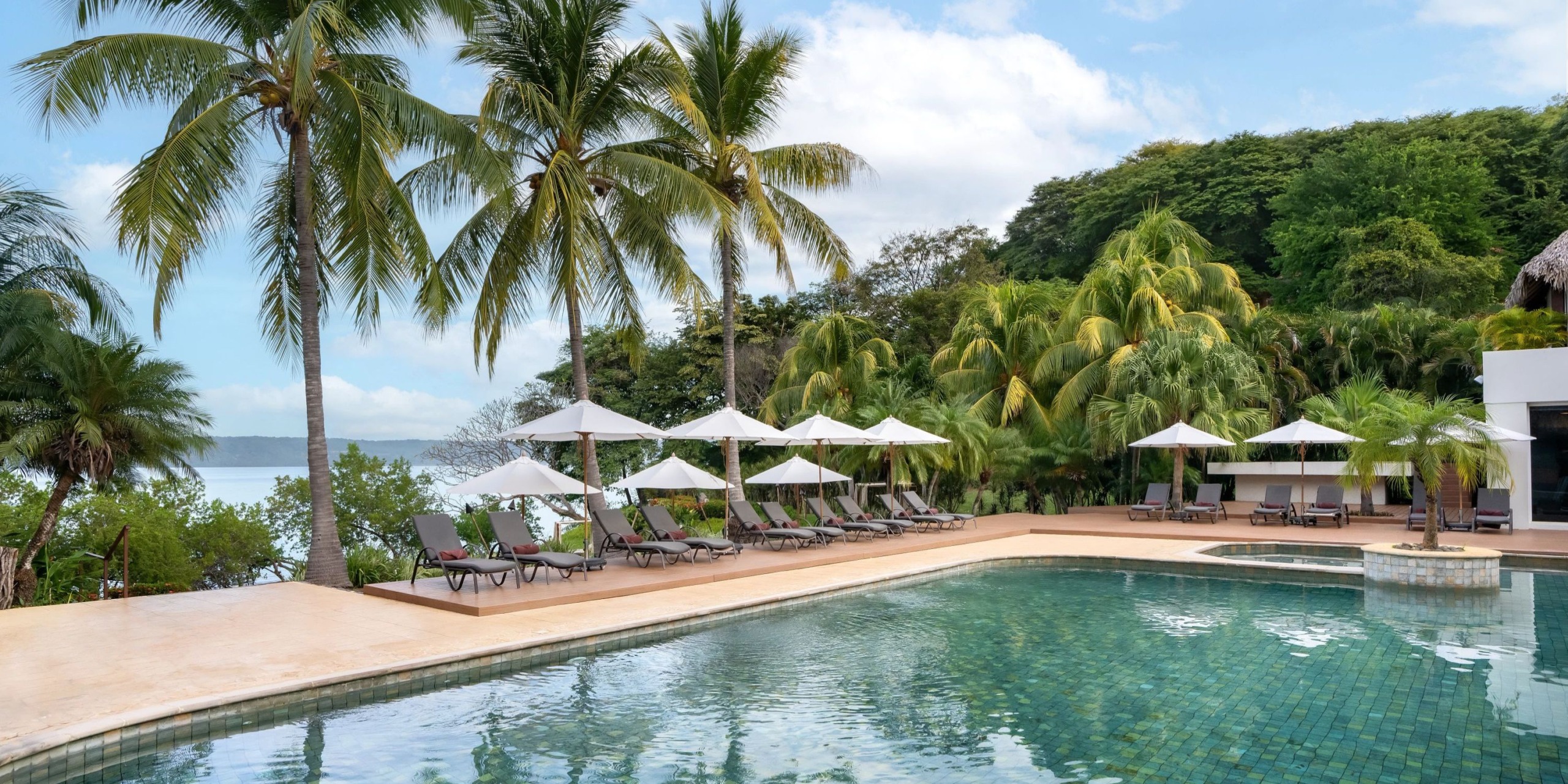 Spa Pool Deck poolside venue with lounge seating and ocean views at Secrets Papagayo