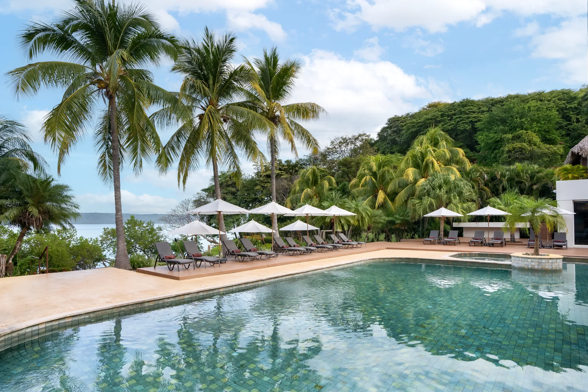 Tranquil spa pool surrounded by tropical greenery at Secrets Papagayo Costa Rica.